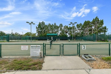 This end-unit Sea Breeze Villa nestled within Pine Meadow on Heritage Pines Country Club in Florida - for sale on GolfHomes.com, golf home, golf lot