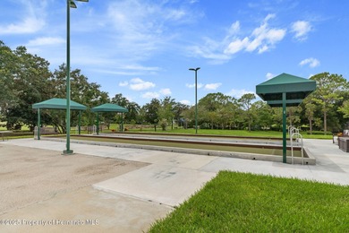 This end-unit Sea Breeze Villa nestled within Pine Meadow on Heritage Pines Country Club in Florida - for sale on GolfHomes.com, golf home, golf lot