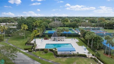 Beautiful water view 2/2 condo is presented to you with enclosed on Wynmoor Golf Course in Florida - for sale on GolfHomes.com, golf home, golf lot