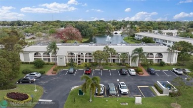 Beautiful water view 2/2 condo is presented to you with enclosed on Wynmoor Golf Course in Florida - for sale on GolfHomes.com, golf home, golf lot