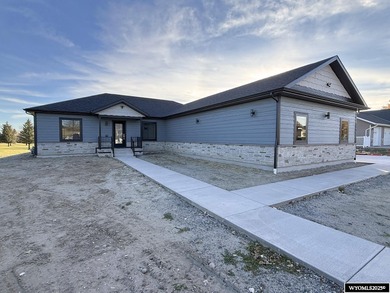 Step into this incredible custom-built home at 4225 Windsong on  in Wyoming - for sale on GolfHomes.com, golf home, golf lot