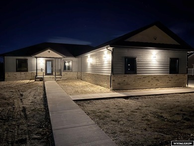 Step into this incredible custom-built home at 4225 Windsong on  in Wyoming - for sale on GolfHomes.com, golf home, golf lot