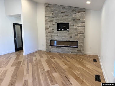 Step into this incredible custom-built home at 4225 Windsong on  in Wyoming - for sale on GolfHomes.com, golf home, golf lot