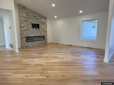 Step into this incredible custom-built home at 4225 Windsong on  in Wyoming - for sale on GolfHomes.com, golf home, golf lot