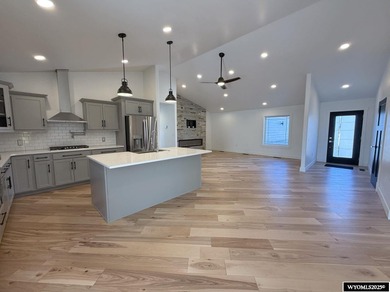 Step into this incredible custom-built home at 4225 Windsong on  in Wyoming - for sale on GolfHomes.com, golf home, golf lot