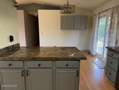 CHARMING SINGLE-STORY HOME NEAR LAKE TAHOE Welcome to your on Sun Ridge Golf Course in Nevada - for sale on GolfHomes.com, golf home, golf lot