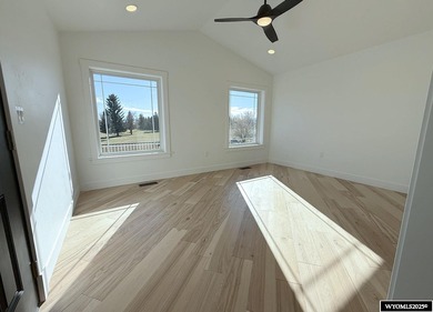 Step into this incredible custom-built home at 4225 Windsong on  in Wyoming - for sale on GolfHomes.com, golf home, golf lot
