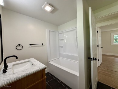 Step into quiet luxury with this beautifully rebuilt 3-bedroom on Pine Lakes Golf Club in Ohio - for sale on GolfHomes.com, golf home, golf lot