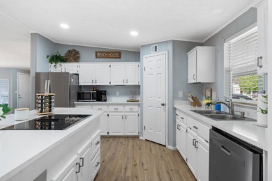 Step into this warm and welcoming 2 bed/ 2 bath completely on Spanish Lakes Fairways in Florida - for sale on GolfHomes.com, golf home, golf lot