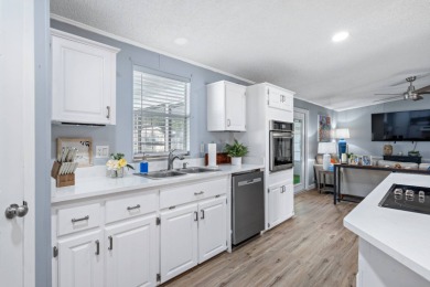 Step into this warm and welcoming 2 bed/ 2 bath completely on Spanish Lakes Fairways in Florida - for sale on GolfHomes.com, golf home, golf lot