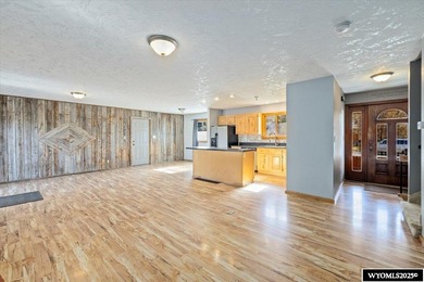 Enjoy golf course living in this inviting 3-bedroom, 2-bath on Paradise Valley Country Club in Wyoming - for sale on GolfHomes.com, golf home, golf lot