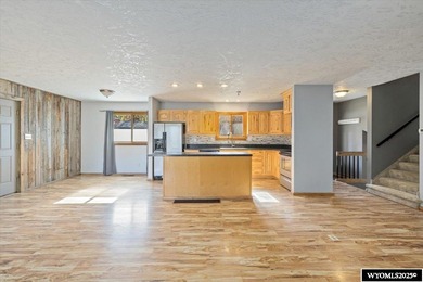 Enjoy golf course living in this inviting 3-bedroom, 2-bath on Paradise Valley Country Club in Wyoming - for sale on GolfHomes.com, golf home, golf lot