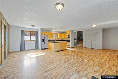 Enjoy golf course living in this inviting 3-bedroom, 2-bath on Paradise Valley Country Club in Wyoming - for sale on GolfHomes.com, golf home, golf lot