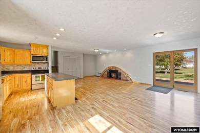 Enjoy golf course living in this inviting 3-bedroom, 2-bath on Paradise Valley Country Club in Wyoming - for sale on GolfHomes.com, golf home, golf lot