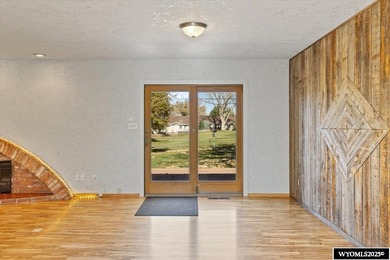 Enjoy golf course living in this inviting 3-bedroom, 2-bath on Paradise Valley Country Club in Wyoming - for sale on GolfHomes.com, golf home, golf lot