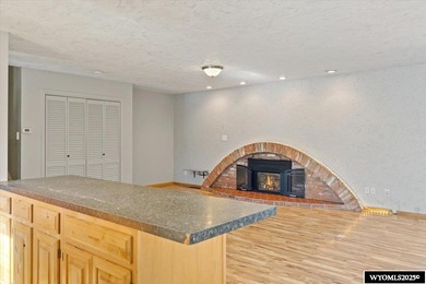 Enjoy golf course living in this inviting 3-bedroom, 2-bath on Paradise Valley Country Club in Wyoming - for sale on GolfHomes.com, golf home, golf lot