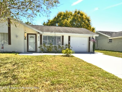 Discover move-in-ready convenience in this charming 2-bedroom on Heritage Pines Country Club in Florida - for sale on GolfHomes.com, golf home, golf lot
