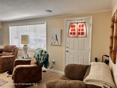 Discover move-in-ready convenience in this charming 2-bedroom on Heritage Pines Country Club in Florida - for sale on GolfHomes.com, golf home, golf lot
