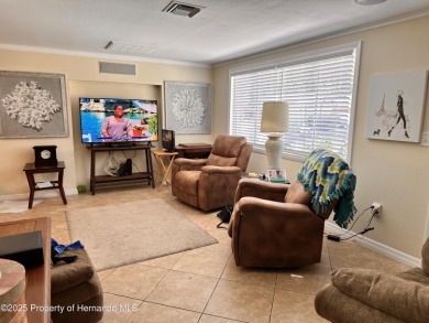 Discover move-in-ready convenience in this charming 2-bedroom on Heritage Pines Country Club in Florida - for sale on GolfHomes.com, golf home, golf lot