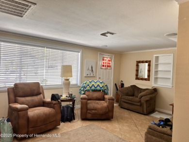 Discover move-in-ready convenience in this charming 2-bedroom on Heritage Pines Country Club in Florida - for sale on GolfHomes.com, golf home, golf lot