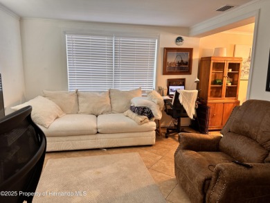 Discover move-in-ready convenience in this charming 2-bedroom on Heritage Pines Country Club in Florida - for sale on GolfHomes.com, golf home, golf lot