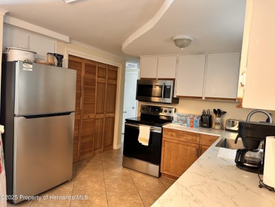 Discover move-in-ready convenience in this charming 2-bedroom on Heritage Pines Country Club in Florida - for sale on GolfHomes.com, golf home, golf lot