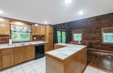 Welcome to Timber Cottage - This charming log home, built in on Apple Valley Golf Course in Ohio - for sale on GolfHomes.com, golf home, golf lot