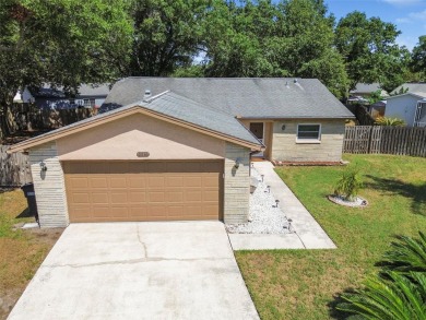 Welcome to this charming 3-bedroom, 2-bathroom home situated on on Countryside Country Club in Florida - for sale on GolfHomes.com, golf home, golf lot