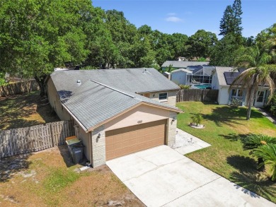 Welcome to this charming 3-bedroom, 2-bathroom home situated on on Countryside Country Club in Florida - for sale on GolfHomes.com, golf home, golf lot