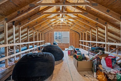 Set in Tillery Tradition, this home offers a relaxed, active on The Tillery Tradition Country Club in North Carolina - for sale on GolfHomes.com, golf home, golf lot