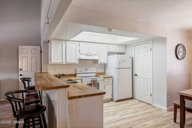 Nestled in the peaceful pines, this fully furnished 3-bedroom on Pinetop Lakes Golf and Country Club in Arizona - for sale on GolfHomes.com, golf home, golf lot