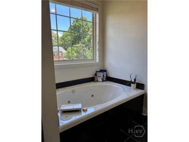 Enjoy life in this beautiful all-brick, low maintenance home in on Jennings Mill Country Club in Georgia - for sale on GolfHomes.com, golf home, golf lot