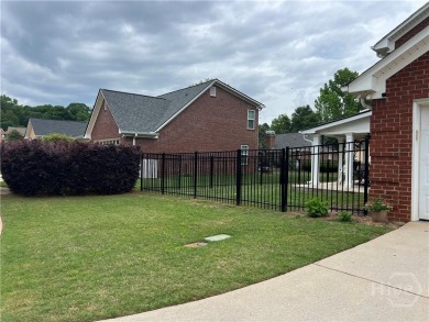 Enjoy life in this beautiful all-brick, low maintenance home in on Jennings Mill Country Club in Georgia - for sale on GolfHomes.com, golf home, golf lot
