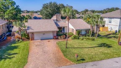 Enjoy the Gulf Breeze lifestyle in this waterfront home with on Tiger Point Golf and Country Club in Florida - for sale on GolfHomes.com, golf home, golf lot