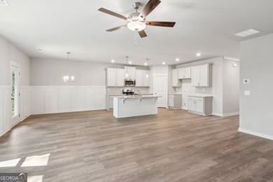 Welcome to 4306 Links Blvd, a charming ranch-style home with a on Traditions of Braselton Golf Club in Georgia - for sale on GolfHomes.com, golf home, golf lot