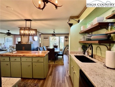 Escape to the mountains in this charming fully furnished on Sugar Mountain Golf Course in North Carolina - for sale on GolfHomes.com, golf home, golf lot