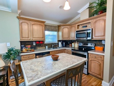 This beautiful and spacious park home has amazing views of the on The Great Outdoors Golf and Country Club in Florida - for sale on GolfHomes.com, golf home, golf lot