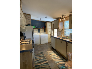 Exceptional 3-Bedroom, 2-Bath Manufactured Home on Prime Corner on Sierra Del Rio Golf Club in New Mexico - for sale on GolfHomes.com, golf home, golf lot