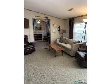 Exceptional 3-Bedroom, 2-Bath Manufactured Home on Prime Corner on Sierra Del Rio Golf Club in New Mexico - for sale on GolfHomes.com, golf home, golf lot