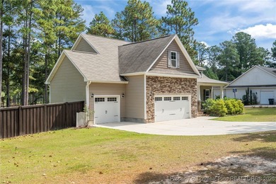 3 car garage, nearly 1 acre lot, screened porch and primary on Bluff Golf Links in North Carolina - for sale on GolfHomes.com, golf home, golf lot