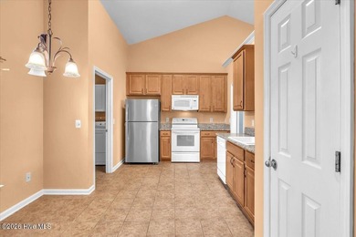 Welcome to 501 Sandpiper Bay SW, a beautifully maintained on Sandpiper Bay Golf and Country Club in North Carolina - for sale on GolfHomes.com, golf home, golf lot