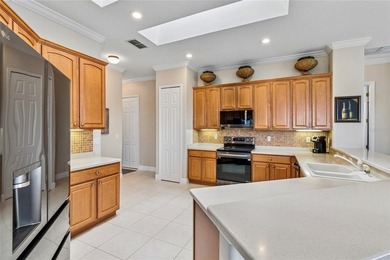 OPERETTA MODEL WITH EXPANSIVE WATER & GOLF COURSE VIEWS! Located on Poinciana Golf Club in Florida - for sale on GolfHomes.com, golf home, golf lot