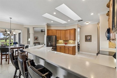 OPERETTA MODEL WITH EXPANSIVE WATER & GOLF COURSE VIEWS! Located on Poinciana Golf Club in Florida - for sale on GolfHomes.com, golf home, golf lot