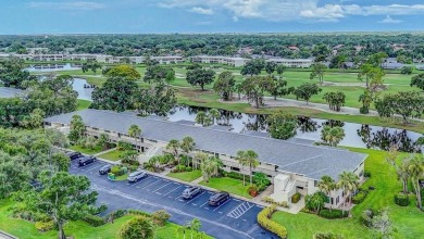 Rare First-Floor 3-Bedroom Corner Condo with Golf Course Views - on University Park Country Club in Florida - for sale on GolfHomes.com, golf home, golf lot