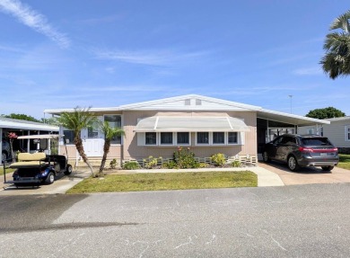 Location, Location, Location!  This home has great curb appeal on Grasslands Golf and Country Club in Florida - for sale on GolfHomes.com, golf home, golf lot