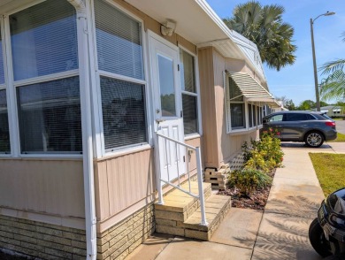 Location, Location, Location!  This home has great curb appeal on Grasslands Golf and Country Club in Florida - for sale on GolfHomes.com, golf home, golf lot