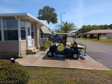 Location, Location, Location!  This home has great curb appeal on Grasslands Golf and Country Club in Florida - for sale on GolfHomes.com, golf home, golf lot