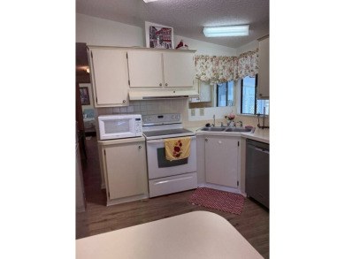 This lovely, 2/2 manufactured home is on leased land. Located in on Pine Lakes Country Club in Florida - for sale on GolfHomes.com, golf home, golf lot