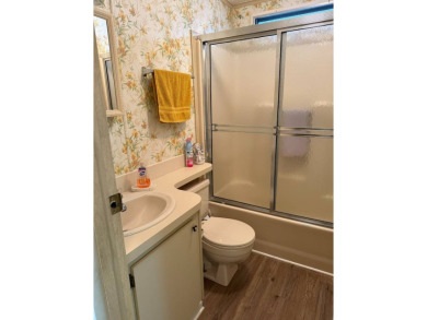 This lovely, 2/2 manufactured home is on leased land. Located in on Pine Lakes Country Club in Florida - for sale on GolfHomes.com, golf home, golf lot