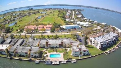 Experience the Magic of Waterfront Living at Spanish Trace on Cocoa Beach Country Club in Florida - for sale on GolfHomes.com, golf home, golf lot